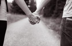 Couple,Walking,While,Holding,Hands.